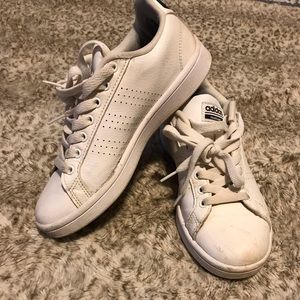 Well worn adidas sneakers